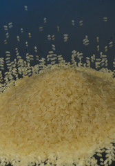 Raw rice as background. Mirror