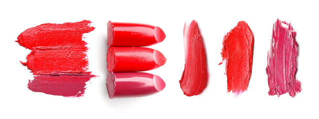 Samples of bright lipsticks on white background