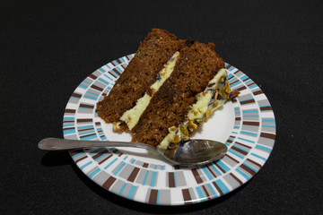 Portion of homemade chocolate cake and white chocolate with flowers