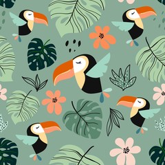 Tropical seamless pattern with exotic design, colorful toucan and palm leaf