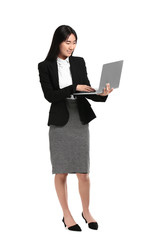Beautiful Asian secretary with laptop on white background