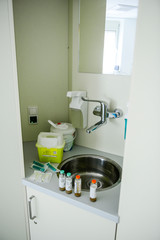 Hands desinfection dispenser in medical center. Antibacterial procedure. Health care and sanitary