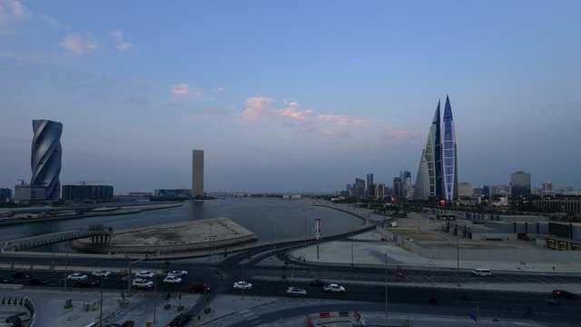 4k Time lapse of Bahrain Skyline with dark clouds and Bahrain World Trade Center from Manama City, Bahrain