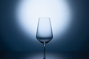 Empty wine glasses on a blue clean gradient background.