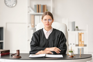 Female judge working at table in office