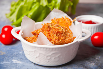 Fried crispy chicken nuggets with ketchup sauce