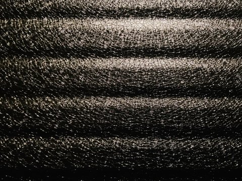 The texture of the metal is multicolored. Made with iPhone 11 in the Republic of Belarus. Mobile photo.