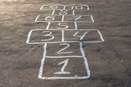 hopscotch game on the pavement, a drawing of the hopscotch game