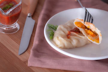  A delicious, diet dish. Steam dumplings.   Manti with pumpkin.
