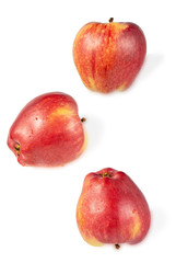 three ripe tasty red apples isolated on white background