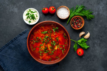 Borscht - Traditional Ukrainian dish in a plate on a stone background