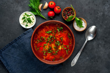 Borscht - Traditional Ukrainian dish in a plate on a stone background