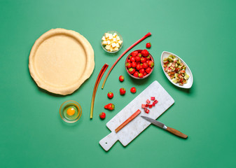 Making a pie at home. Strawberries and rhubarb pie ingredients