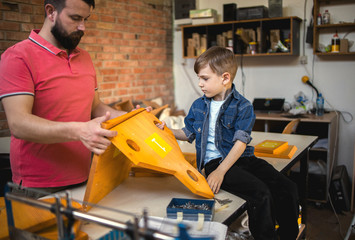 	
Father and Son Making a Birdhouse