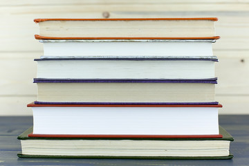 Pile of open books on the table