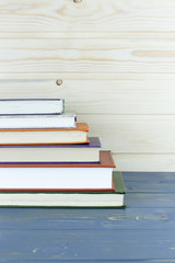 A pile of books with library on the back