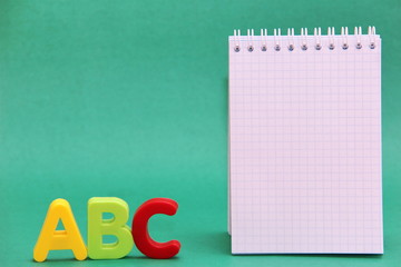 English ABC alphabet letters and the Notepad page. Learning foreign language.