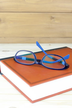 round glasses on a book vintage
