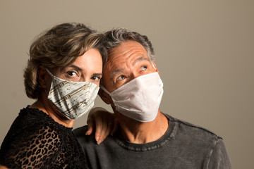 Couple Wearing Protective Face Mask to Combat the Spreading of Covid-19 