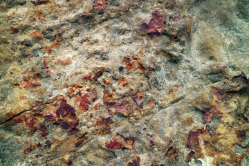 Fototapeta na wymiar ancient heavy rust copper granite stone surface of cave for interior wallpaper