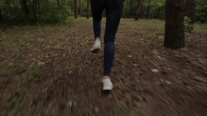Scared women legs run away in a dense forest, original audio included
