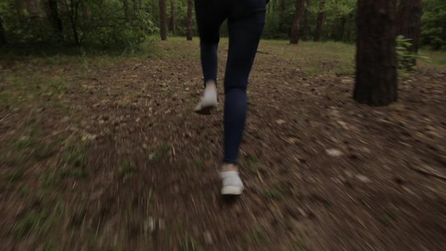 Scared women legs run away in a dense forest, original audio included