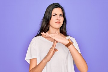Young beautiful brunette woman wearing casual white t-shirt over purple background Doing time out...
