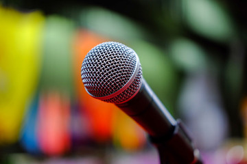 Microphone  with abstract blurred in speech public
