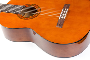 Fototapeta premium Acoustic guitar neck with body and strings on white background in close-up