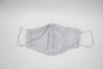 Plain sanitary napkin mask, gray color On a white background, a mask is preferred to be used during the outbreak. Covid 19.