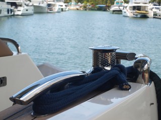 View of elements of luxury yacht using for mooring. A horn cleat in a traditional design, featuring...
