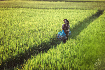 Naklejka na ściany i meble Portrait of Thai young woman farmer, Thailand countryside