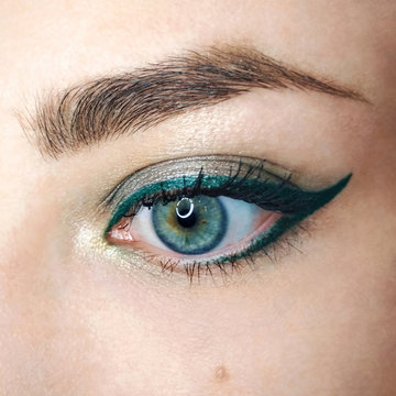 Blue eye gold green arrow eyeliner make-up eyebrow lash cosmetic swatch fashion macro photo