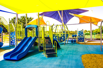 Kids Playground Equipment Covered By Colorful Shade Canopies