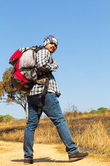 Young man traveler with backpack hiking Lifestyle adventure concept, adventure active summer Forest, Hiking, Journey background.