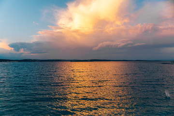 sunset over sea water bay