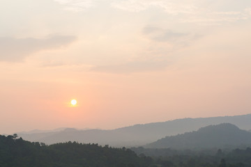 Sunset scene with silhouette mountain at Khun Dan Prakan Chon Dam