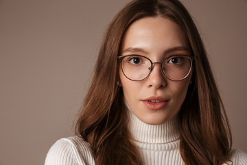 Photo of young beautiful woman posing and looking at camera