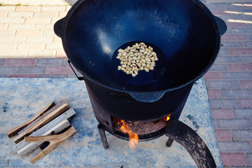 Roasting of mutton fat to a condition of crackers, some stage of preparation of a national Uzbek...