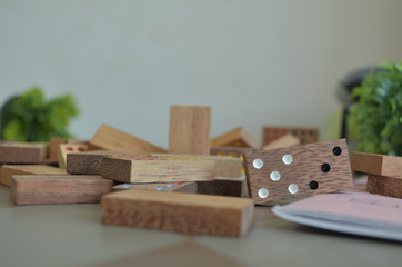 Wooden domino on the table.