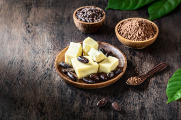 Cacao products on old rustic background.