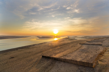empty beach sunset on river delta