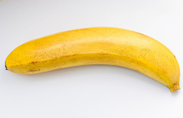 slices of a yellow banana in a cut on a white background macro shot