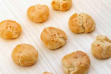 homemade brioches on a wooden board, french bakery