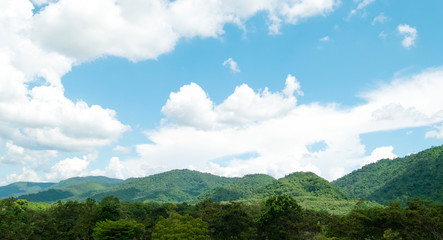 Green mountains and beautiful sky clouds under blue sky. Outdoor landscape natural background.
