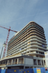 Fototapeta na wymiar Construction site with crane and building