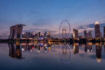 Wide panorama image of Singapore skyscrapers at magic hour