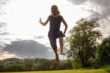 Fototapeta na wymiar teen jumping for zest for life.