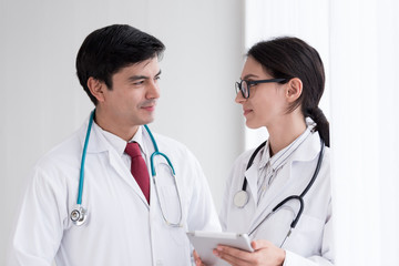 Two doctors have working together with happiness in the hospital.