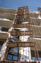 Workers work on scaffolding
